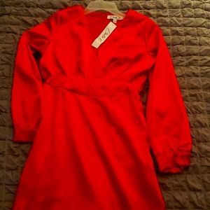 Red satin like long sleeve dress. Misplaced matching belt. NEVER WORN